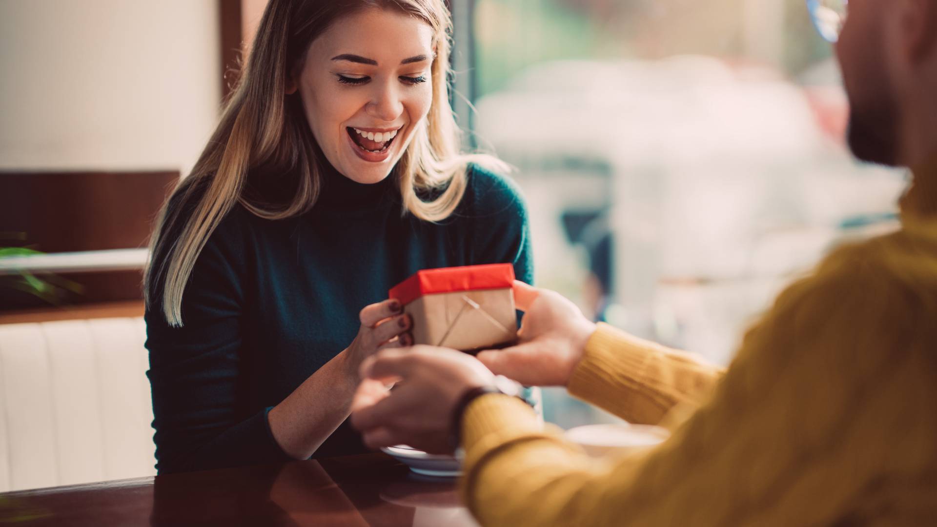 Woman happy about gift from friend