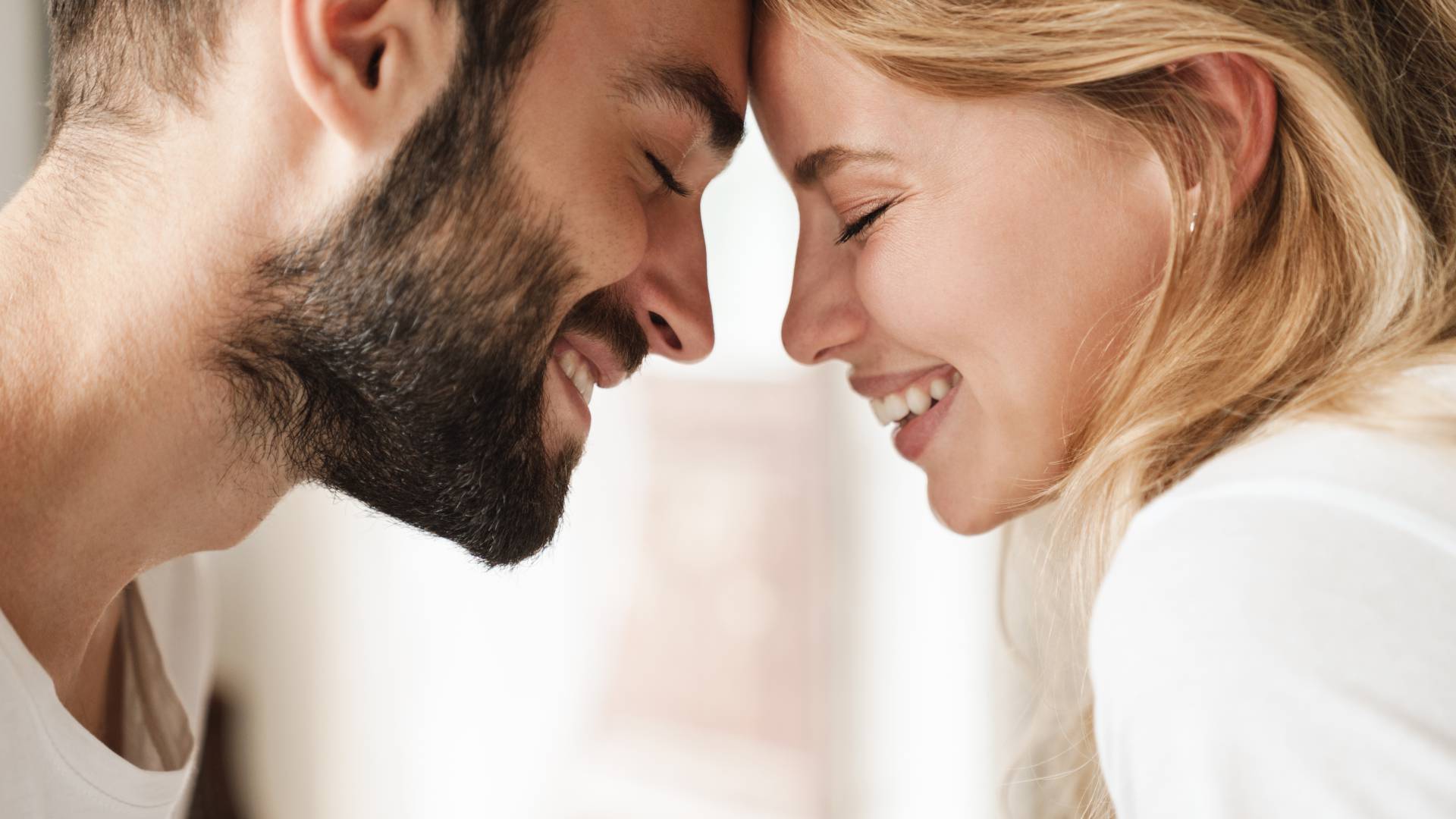 Couple in love smile at each other