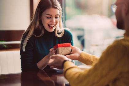 Woman happy about gift from friend