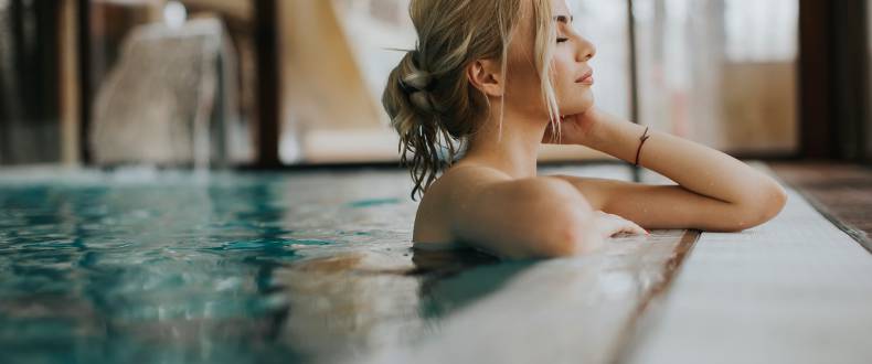 Woman relaxing in the indoor pool