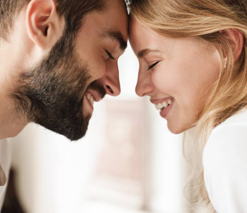 Couple in love smile at each other